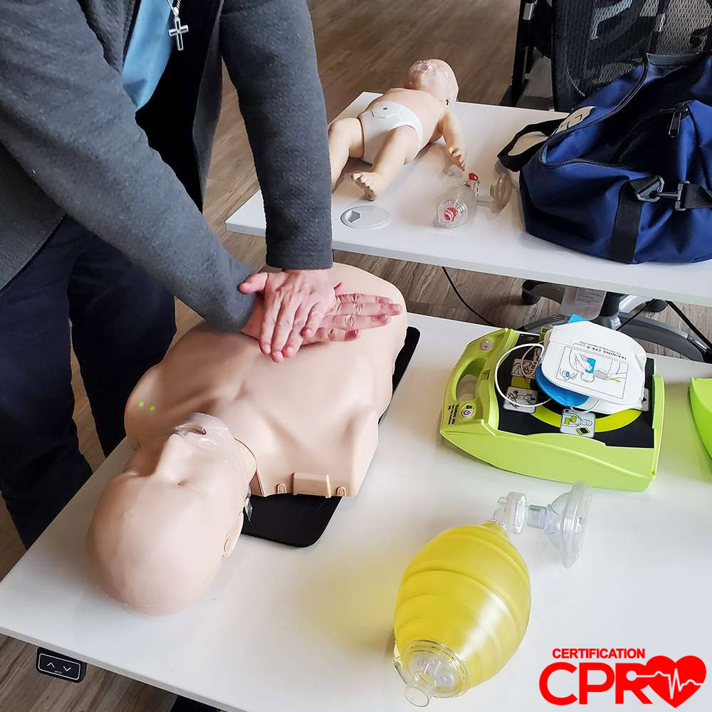 CPR training on mannequin for certification in Tampa.