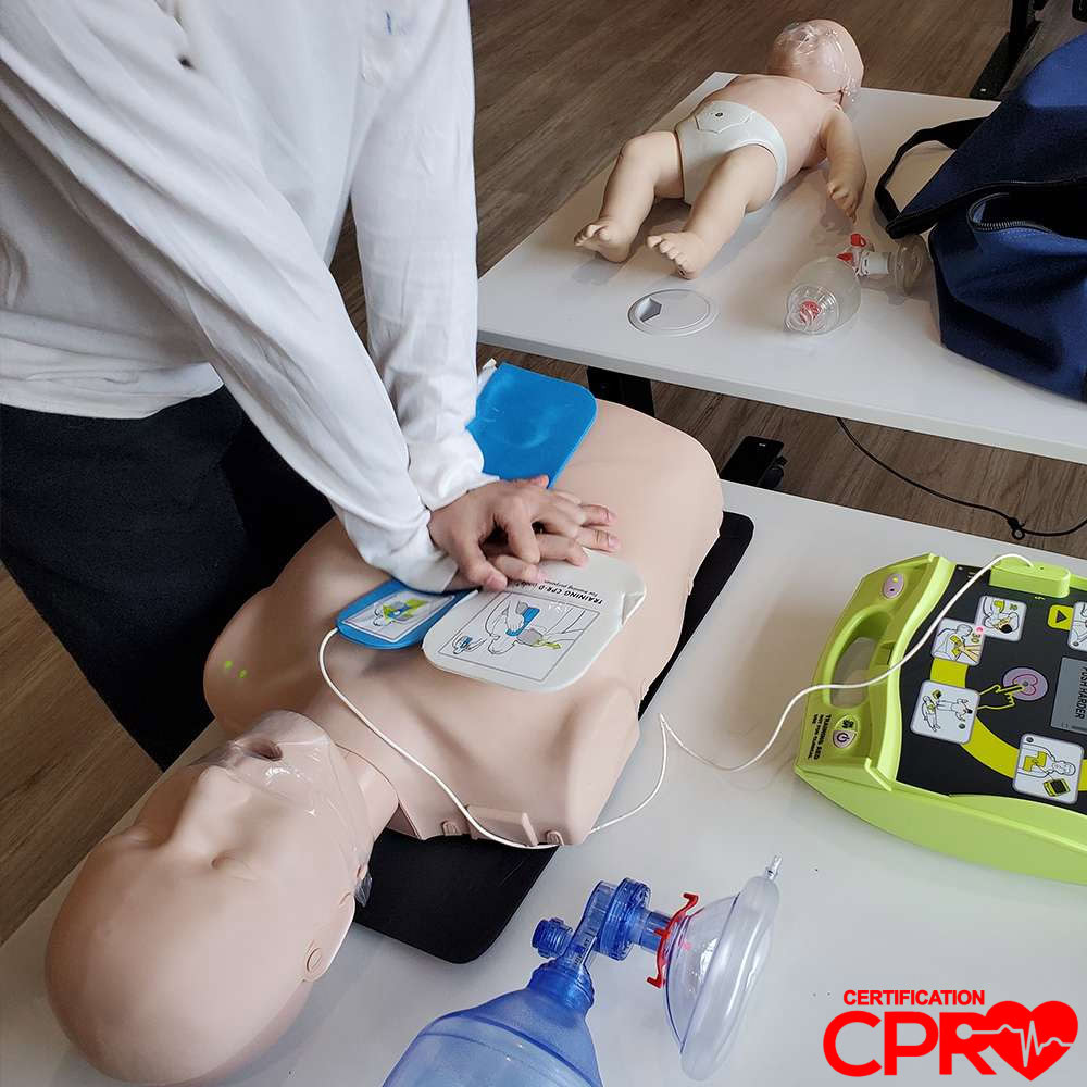 CPR training with mannequin and AED for certification in Tampa.