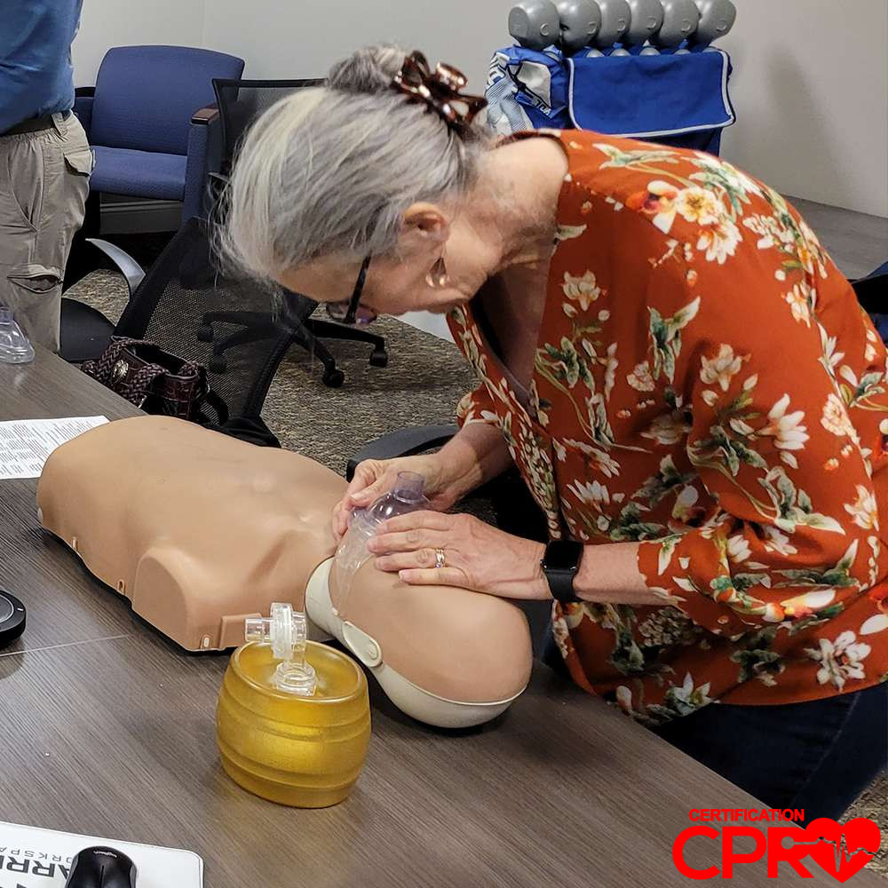 CPR training session with adult mannequin in Tampa.
