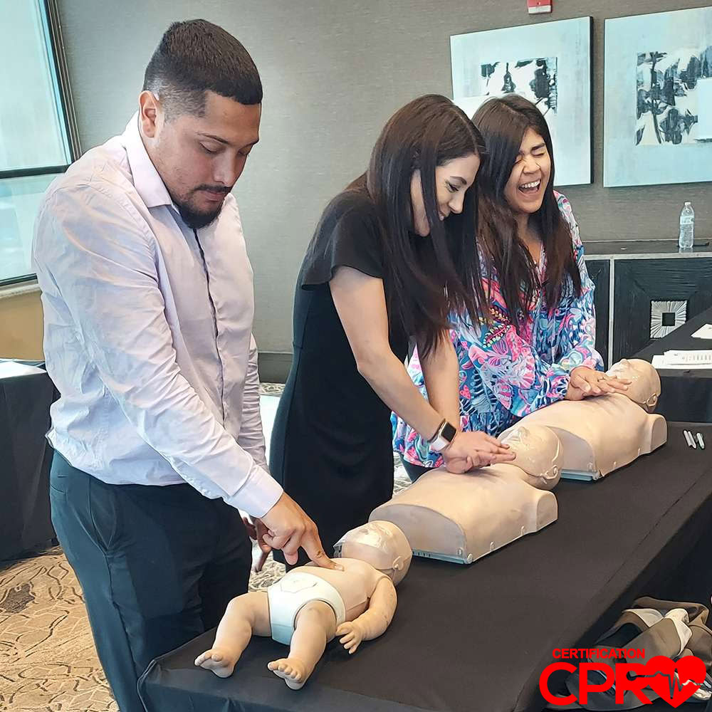 CPR training class in Tampa with students practicing on mannequins.
