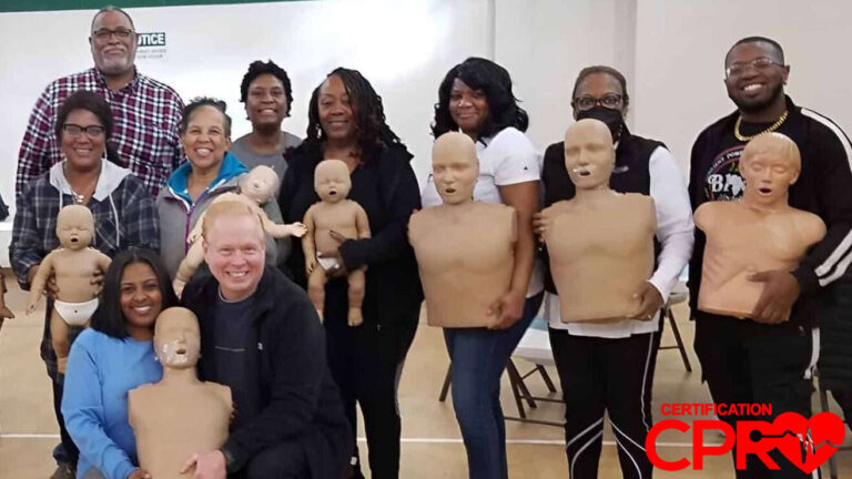 Group CPR training session in Tampa with mannequins for certification.