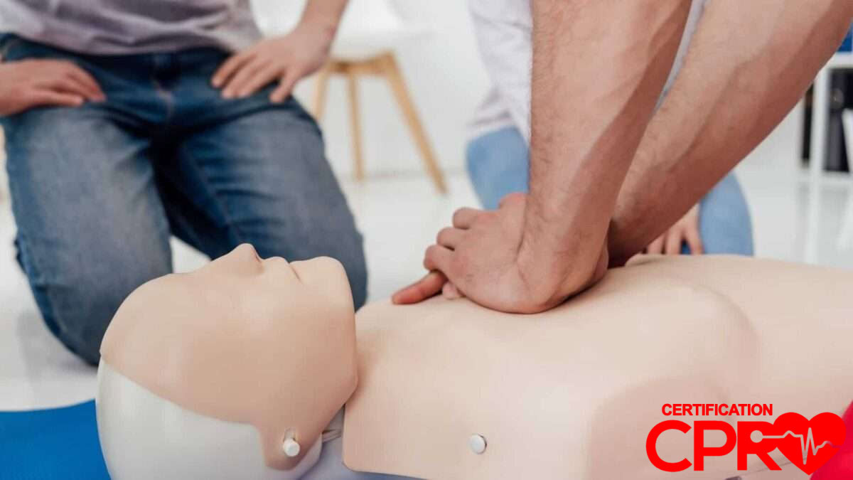 CPR training session with a man practicing on a mannequin in Tampa.